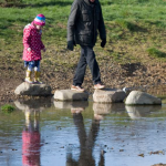 Grandfather and granddaughter enjoyinh Firs Farm Wetlands togehter