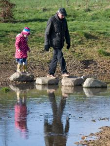 Grandfather and granddaughter enjoyinh Firs Farm Wetlands togehter